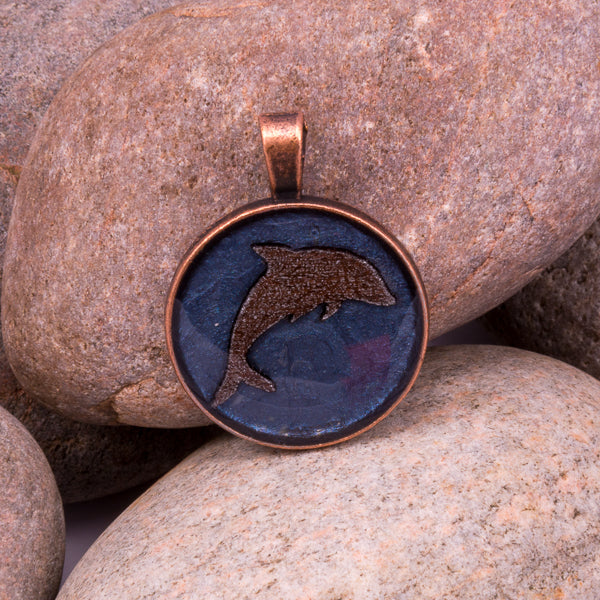 Handcrafted Bespoke Leaping Dolphin Pendant; set in copper effect metal bezel.| Jabbawocky Crafts (jabbawockycrafts.co.uk)