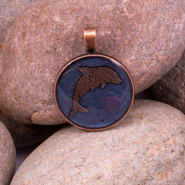 Handcrafted Bespoke Leaping Dolphin Pendant; set in copper effect metal bezel.| Jabbawocky Crafts (jabbawockycrafts.co.uk)