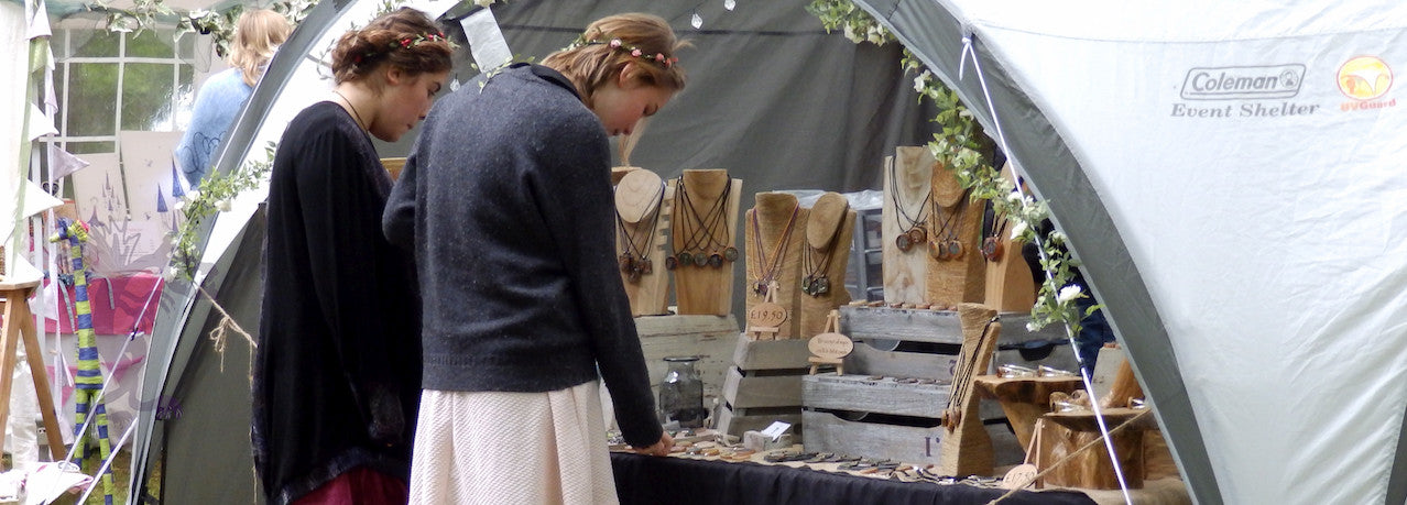 Girls looking at Jabbawocky Pendants