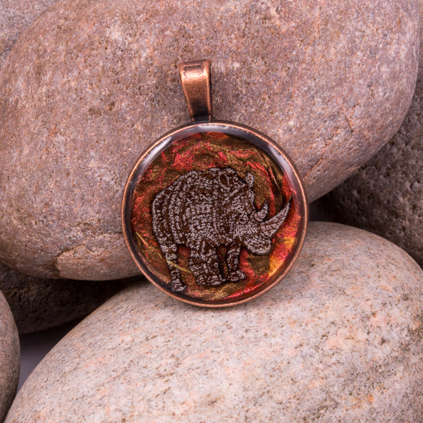 Handcrafted Bespoke Mighty Rhino Pendant; set in copper effect metal bezel.| Jabbawocky Crafts (jabbawockycrafts.co.uk)