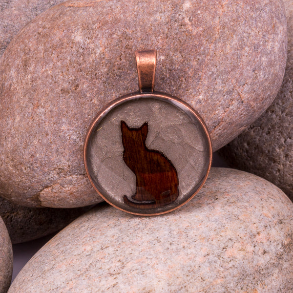 Handcrafted Bespoke Curious Cat Pendant; set in copper effect metal bezel.| Jabbawocky Crafts (jabbawockycrafts.co.uk)